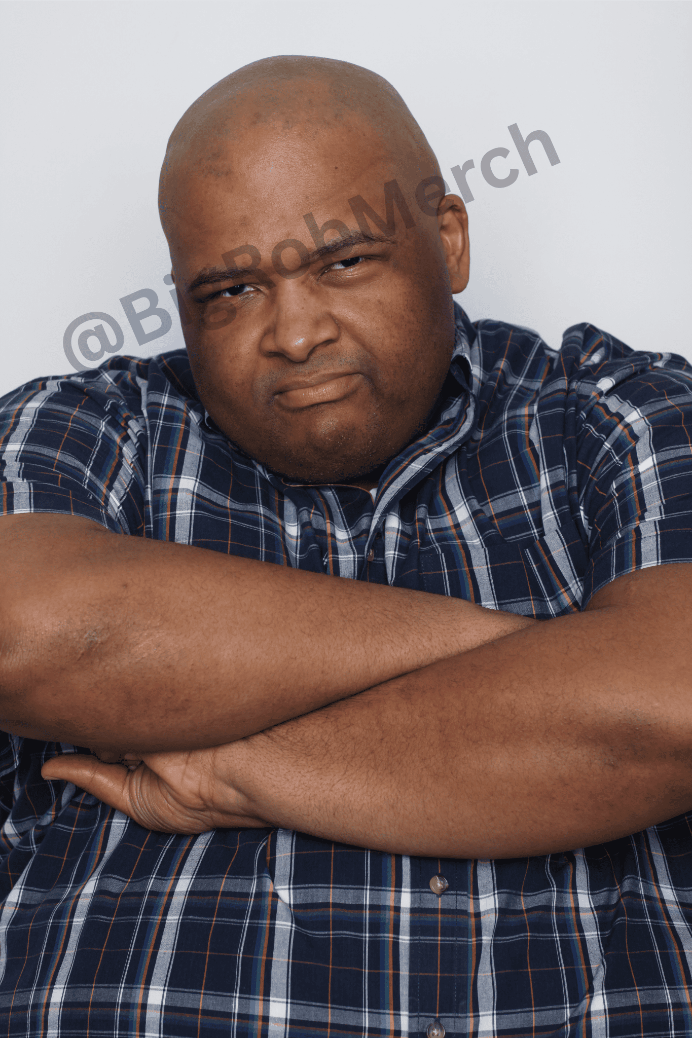Autographed photo of Big Rob in blue checkered shirt with arms crossed